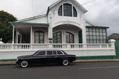 COSTA RICA WHITE AND GREEN MANSION. MERCEDES W123 LIMOUSINE SERVICE